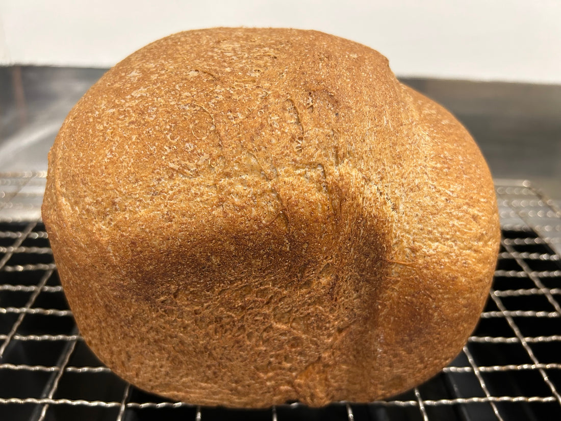Wheat loaf of bread baked in breadmaker or oven